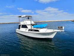 Northshore 37 Flybridge Cruiser " DIESEL SHAFT, BOW THRUSTER, DUAL HELMS "